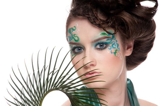 Close-up of sprite girl with faceart and plant