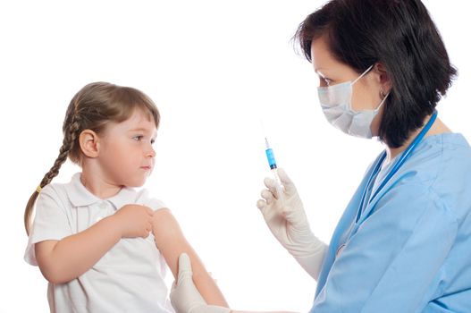 doctor does an inoculation to girl