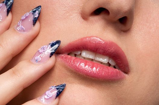 Close-up lips makeup zone and nail art