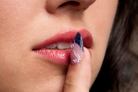 Close-up lips makeup zone and nail art