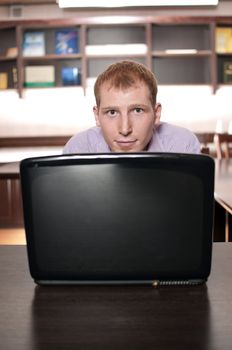 Emotional businessman with laptop