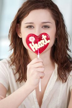 Pretty woman with candy heart