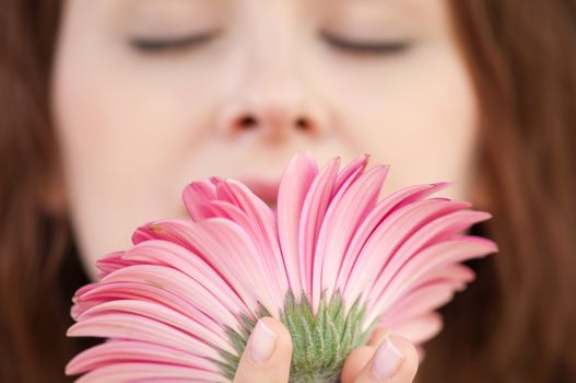 Happy woman with flower at dating