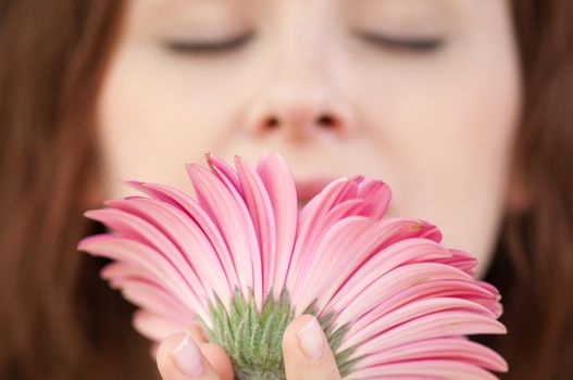 Happy woman with flower at dating