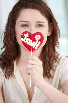 Pretty woman with candy heart
