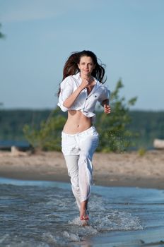 Sporty woman running on water