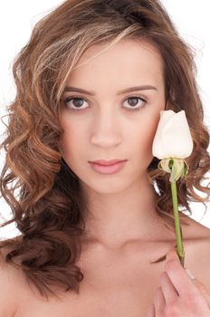 Close-up of beautiful girl with white rose flower