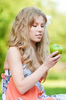 Beautiful woman with green apple
