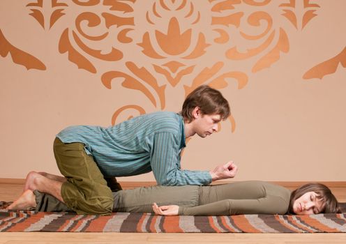 Couple doing yoga. Massage