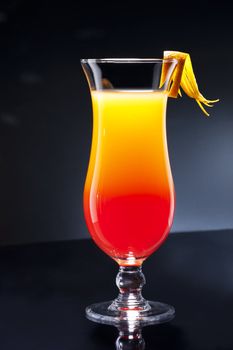 Tequila sunrise, the story about the drink says that it was first served in Cancun and Acapulco in the 1950's. After a brief surge in 70's discos, it lost much of its glory.