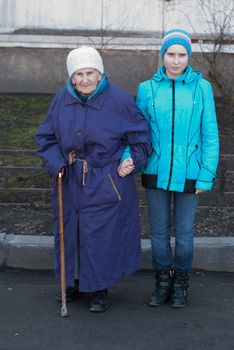 Grandmother and granddaughter for a walk.
