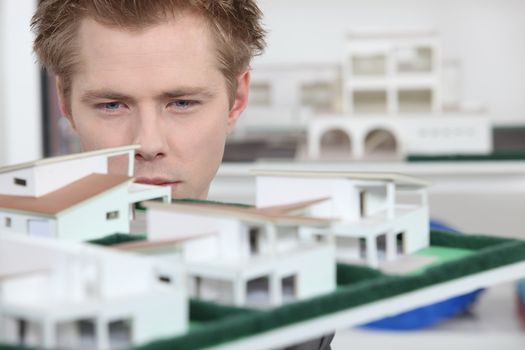 Property developer inspecting model