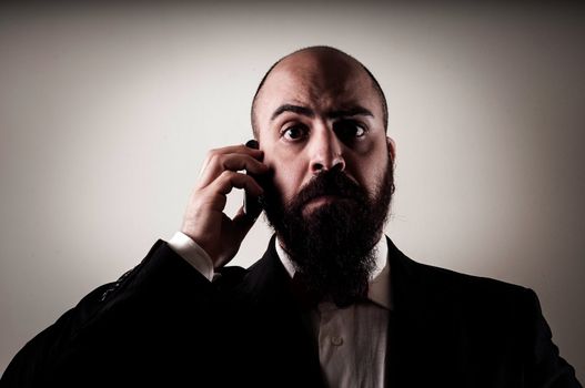 funny elegant bearded man on the phone