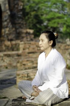 Asian woman meditating yoga