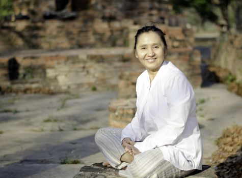 Smiling woman meditating 