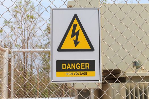 Danger High Voltage sign on a fence