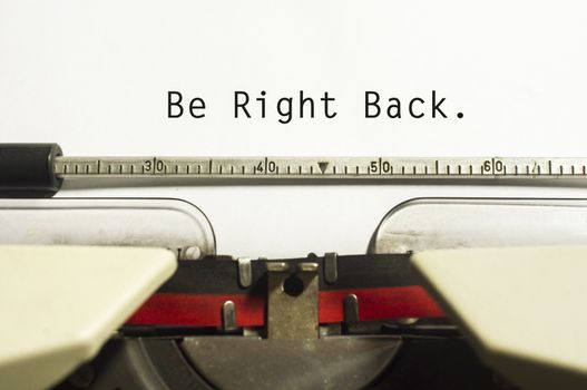 be right back concepts, with message on typewriter. For website maintenance message.