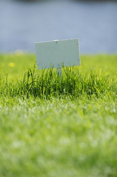 White signboard on grass