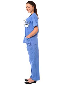Title:Side pose of a young female doctor in uniform