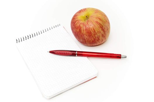 notebook with apple on a white background