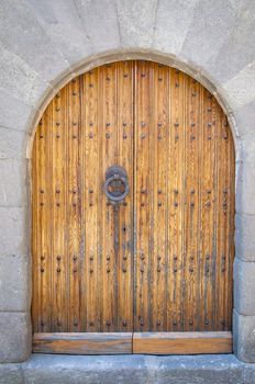 old wooden door with stone wall