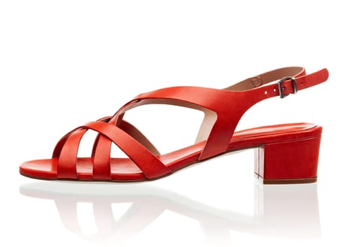 Red female sandal isolated over white background