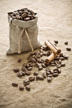 coffee beans and cinnamon on sacking