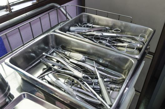 Set of dental tools for teeth care on stainless steel tray