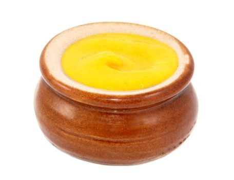 English or American mustard served in a small ceramic pot