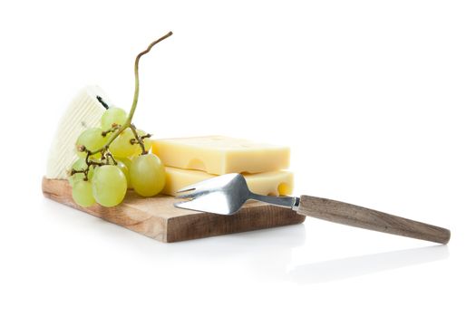 cheeseboard of hard and blue cheese with grapes