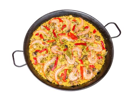 Traditional spanish paella cooked in a pan