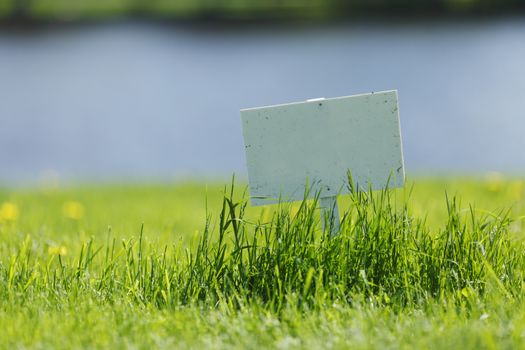 White signboard on grass