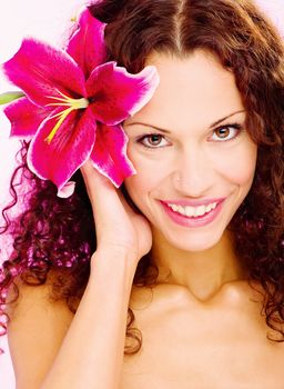 woman with flower in her curl hair