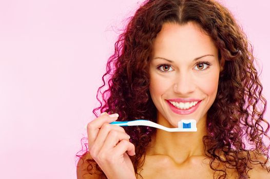 portrait of a smiling woman and teeth brush