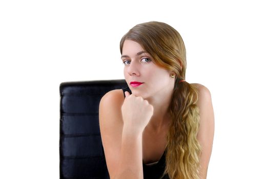 Portrait of a pretty young female sitting on a chair