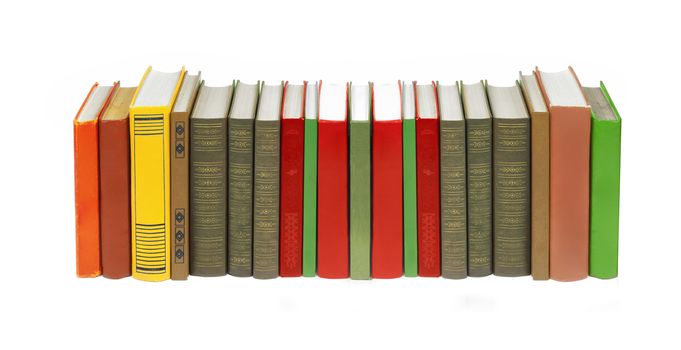 Collection of books standing on a white background