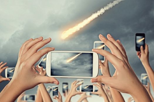 People taking photo of meteorite
