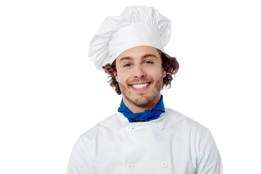 Young male chef wearing toque