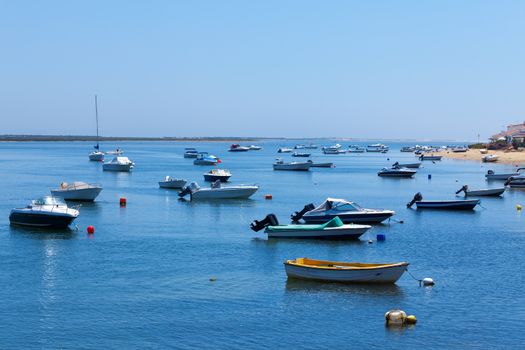 Mooring of boats near the shore, sunny day