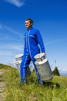 farmer with milk containers