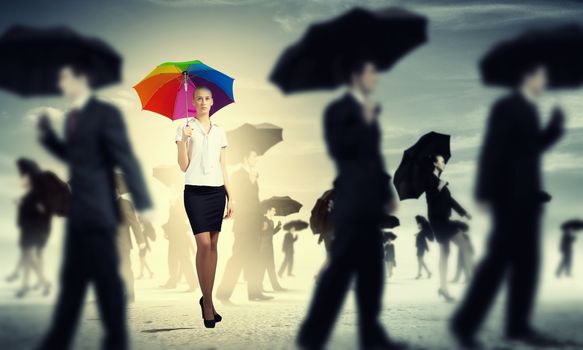 Businesswoman with umbrella