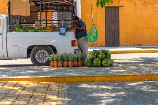 Selling Watermelon and Papaya on the streets of Yucatan 