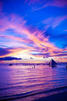 Sailing boat in awesome sunset in Boracay island on Philippines