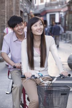 Young Heterosexual Couple on a Tandem Bicycle in Beijing