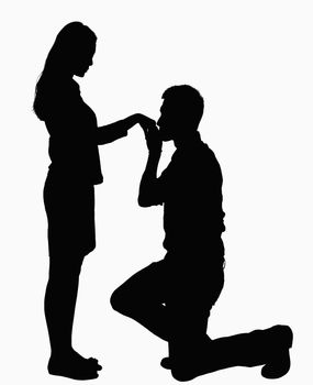 Silhouette of man on one knee, kissing woman's hand.