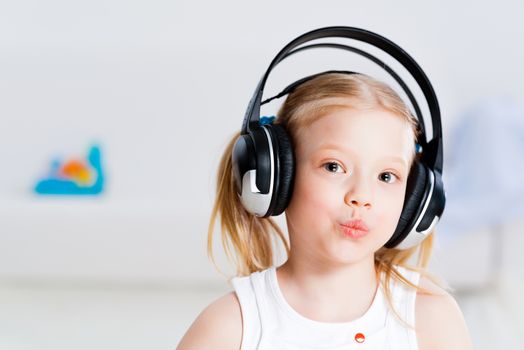Pretty girl listening to music on headphones
