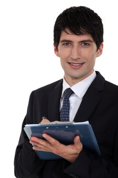 Male office worker with clip-board and pen