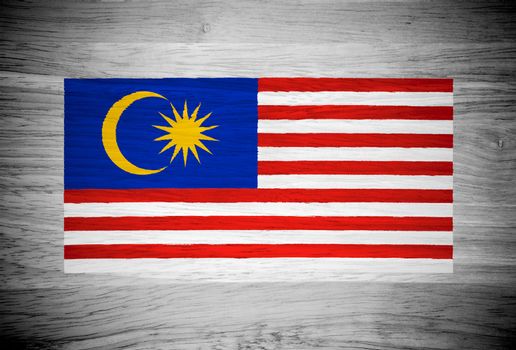 Malaysia flag on wood texture