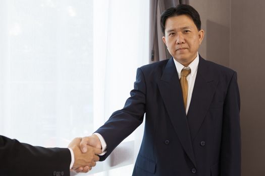 Business handshake with CEO