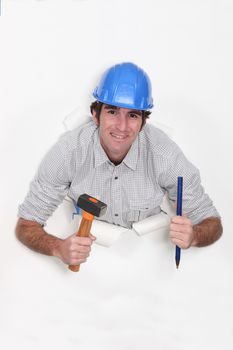 Builder with a hammer and chisel